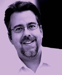 THE DOCTOR PUTS ON HIS CAMOUFLAGE UNIFORM AND A BULLETPROOF VEST.