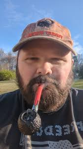 Mowing the yard for the first time this year. Smoking some Cult Blood Red  Moon in the Peterson Halloween 2024 pipe.