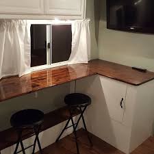 We Took Out The Dinette And Created A Storage Cabinet To The Right Above The Storage Compartment A Breakfast Bar Diy Camper Remodel Dinette Camper Makeover