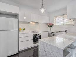 Ikea abstract kitchen (white high gloss). White Kitchen Cabinets Glossy Gray Tile Floors Kitchen Decor Modern Kitchen Flooring Brick Kitchen