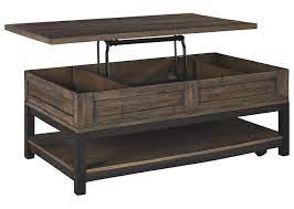 Lift top coffee table is a beautiful and practical table that is designed with a lift top, which can be easily lifted up to have a suitable and comfortable height to use a laptop, write or dine while relaxing on the couch. Johurst Rect Lift Top Cocktail Table Ashley Homestore Canada
