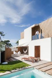 Ernesto Pereira Updates A Coastal Portuguese Home With Timber Clad Cutaways House In The Woods Architecture Architecture House