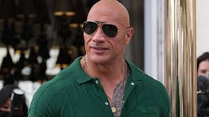 Dwayne 'The Rock' Johnson Goes Green in Percival Polo Shirt for 'Black Adam'  Press Tour in Madrid