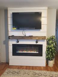 The tennyson glazed pine electric fireplace with bookcases has six shelves built right into the mantel. Cambridge 50 In Wall Mount Electric Fireplace In Black With Multi Color Flames And Driftwood Log Display Cam50wmef 2blk The Home Depot Wall Mount Electric Fireplace Electric Fireplace Wall Built In Electric Fireplace
