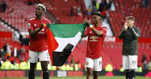 Manchester united midfielder paul pogba became the latest footballer to display the palestinian flag in a show of support as he paraded it around old trafford after the premier league game with fulham. Watch Paul Pogba And Amad Diallo Show Support For Palestine With Flag Planet Football