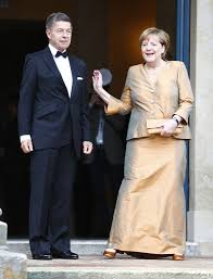 Wir lieben angela merkel ♥ merkel ist das beste staatsoberhaupt auf der welt. Angela Merkel Steps Out In Gold Suit With Husband Joachim Sauer Express Co Uk