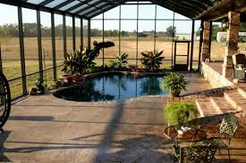 A Greenhouse Attached To The House With One Wall That Can Open Up With A Pool And Hot Tub Inside Indoor Garden Indoor Greenhouse Pool Designs