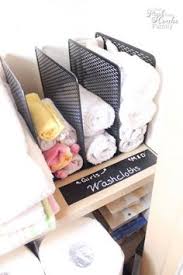 Extra linens fill the top shelf, while daily items sit at a more accessible height. 31 Best Bathroom Towel Storage Ideas Towel Storage Bathroom Towel Storage Bathroom Towels