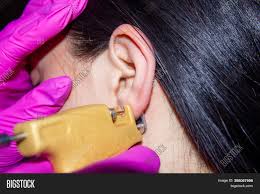 Our ear piercing service at h.samuel is free when you buy a piercing set. Ear Piercing Salon Image Photo Free Trial Bigstock