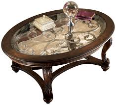 Ashley's coffee tables are popular around the world. Signature Design Norcastle Oval Cocktail Table Ashley Furniture T499 0 Glass Top Coffee Table Oval Coffee Tables Traditional Coffee Table