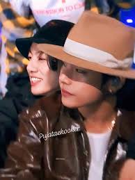 Taehyung holding a 'free hugs' sign and then there's Jin hugging him. My  TaeJin hearteu 🥺💜 ~KookieWifeu💜