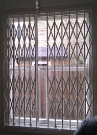 Rsg1000 Concertina Security Grilles Fitted To The Opening Of A Bedroom Of A Residential Complex In Central Londo Interior Window Shutters Door Grill Cafe Decor