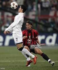 Portuguese Cristiano Ronaldo Of Manchester United Heads A Ball Infront Of Paolo Maldini Of Ronaldo Football Cristiano Ronaldo Style Cristiano Ronaldo Juventus