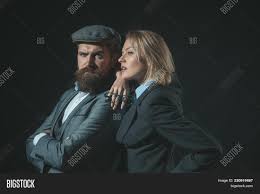 Work hours are often irregular, and the work can be dangerous. Man Woman Retro Suit Image Photo Free Trial Bigstock