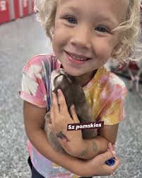 My little helper while I bottle feed babies. He loves