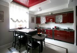 Deep red kitchen cabinets are a practical color choice when working with a darker color palette. Red Kitchen In The Interior 115 Photos Design In Bright Contrasts