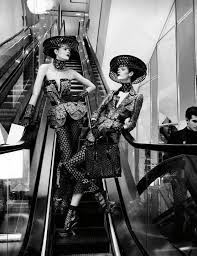 Black And White Fashion Photoshoot Couple Group Pose Escalator Stairs Black And White Fashion Fashion Photography Poses Fashion Photoshoot Fashion Photography