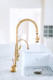 The kitchen sink is the place where most meals start, and the faucet is a crucial tool to aide you in your meal preparation. Antique Brass Gooseneck Faucet On Farm Sink Transitional Kitchen