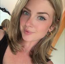 Duck roosting with chickens at night in backyard coop