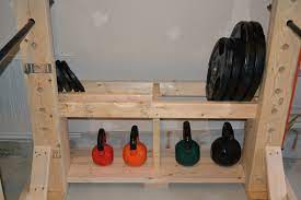 In the back of the gym is a standard bookshelf type of storage, but along the walls are both barbell and sled storage that gets heavy, large pieces of equipment off the floor and onto the walls. Crossfit Brand X Forum My Diy Power Rack Garage Gym Hemmagym