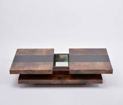 Slide is a contemporary coffee table design inspired by children's sliding puzzle games and the need to organize items always left out. Brown Colored Italian Two Tiered Aldo Tura Sliding Coffee Table With Hidden Bar 1970s 143073