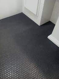The classic black and white combination always looks the part, regardless of whether a bathroom is brand new or has been around for decades. 40 Gallery Of Stunning Penny Round Tiles Penny Hex Shower Floor Tile Penny Tiles Bathroom Penny Tile Floors