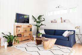 The plant in this living room is a fiddle leaf fig. 15 Plant Filled Living Rooms For Serious Decor Inspiration