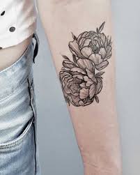 The image of lush pion flowers is a beautiful decoration of the shoulder or wrist. Two Black And Grey Peony Tattoos Tattoogrid Net