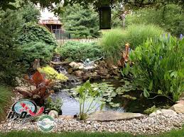 I like the use of stone, cement squares and brick edging.a lot! Koi Pond Backyard Pond Small Pond Ideas For Your Kentucky Landscape Traditional Landscape Louisville By H2o Designs Houzz Nz