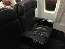 Fortunately there are power ports underneath the center console. Review United Airlines Business Class B737 San Francisco To Mexico City Travelling The World