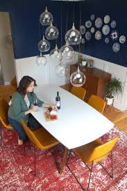 Originally, chair rail moulding was added to dining rooms to protect plaster walls from getting damaged by dining room chairs. Mid Century Dining Room Makeover Behind Our Red Door