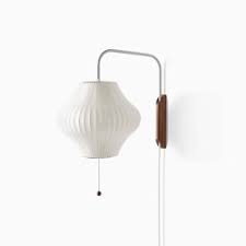 Specifically designed to add ambient lighting in a variety of spaces, wall sconces and wall lamps are shaped to add dramatic up and downlighting effects, adding depth and structure to a room. Nelson Apple Pendant Lamp Architonic