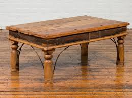 The massive top & shelf give ample room for drinks. Rustic Indian Sheesham Wood Coffee Table With Nailhead Design And Baluster Legs For Sale At 1stdibs