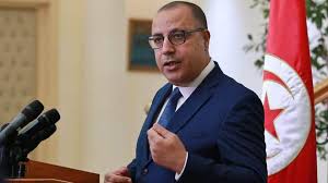 رئيس الوزراء التونسي هشام المشيشي في مؤتمر صحفي في العاصمة تونس يوم 3 يونيو حزيران 2021. Ø§Ù„Ù…Ø´ÙŠØ´ÙŠ ÙŠÙ†Ø¹Ù‰ Ø§Ù„Ø¥Ø¹Ù„Ø§Ù…ÙŠ Ø¨Ø´ÙŠØ± Ø¨Ù† ÙŠØ­Ù…Ø¯ T M B