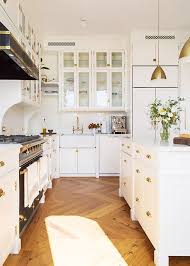 This classic kitchen in the picture above features beautifully carved wood panel cabinets painted in cream. Design Decor Kitchen Inspirations Wood Floor Kitchen Luxury Kitchens