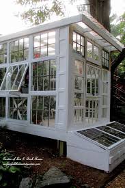This is a great idea for your raised garden beds. Building A Repurposed Windows Greenhouse Diy Greenhouse Plans Outdoor Greenhouse Homemade Greenhouse