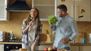 Link/page citation it's an old house in the outskirts of ban. Attractive Young Joyful Couple Have Fun Dancing And Singing While Cooking In The Kitchen At Home Cooking Kitchen Have Fun Attractive