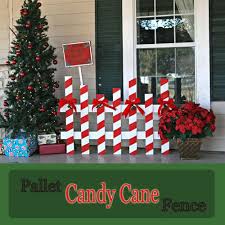 Make A Candy Cane Fence Out Of A Pallet The Pennington Point Outdoor Christmas Decorations Pallet Christmas Christmas Wood