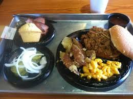 After adding a little liquid to the pot (beer, of course), this baby went to roast all day long until it was falling apart in shreds. Pulled Pork Sandwich W Sides And Extras Picture Of Can T Stop Smokin Bbq Chandler Tripadvisor