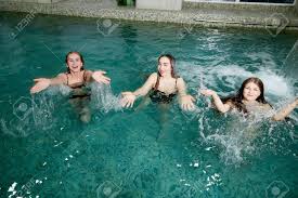 The swimming pool takes centre stage in the living room. Three Girls Having Fun And Enjoying In Swimming Pool Water Inside Building Lizenzfreie Fotos Bilder Und Stock Fotografie Image 126294848