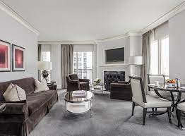 Open gourmet kitchen with granite island and stainless appliances. Luxury Downtown Chicago Hotel Waldorf Astoria Chicago