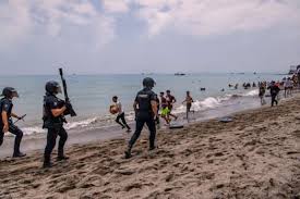 Spain deploys military to Ceuta after thousands of people breach Morocco's border and at least 9 die - AP News
