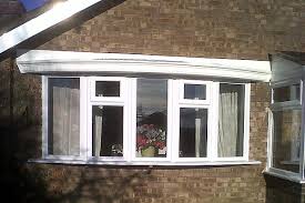 A bay window is a window space projecting outward from the main walls of a building and forming a bay in a room. Windows Clearview Construction Restoration Work