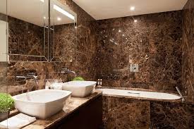 Small bathrooms with blue wall colors look more spacious, fresh and inviting. Bathroom Design Brown Tiles