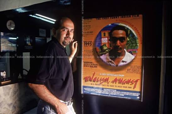 Buy Dev Benegal, Writer and Director standing with the Poster of English August Film at Mumbai Pictures, Images, Photos By HEMANT PITHWA - Archival pictures