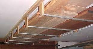 Check this garage door diy idea. Overhead Wood Storage Wood Storage Rack Lumber Storage Garage Ceiling Storage