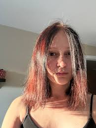 Can I add more purple to my split-dyed hair without re-bleaching?