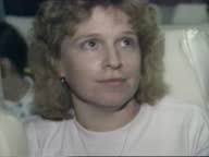 Convoy of busses along Women & children seen