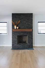 Check spelling or type a new query. Dark Stone Fireplace Flanked By Black Windows This Dark Stone Fireplace Features Slate Sta Stone Fireplace Makeover Fireplace Remodel Brick Fireplace Makeover