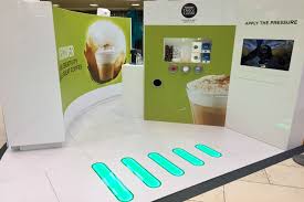 It also has more bells and whistles. Nescafe Dolce Gusto Launches Shopping Centre Campaign With Will I Am